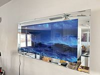 Front view of illuminated mirror panel on wall