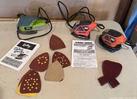 All three corded sanders, sanding sheets, manuals