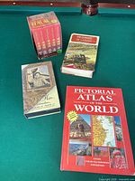 Overview showing atlas, two WWII books and VHS box set