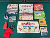 Overview of all boxed games, domino bag, darts, dice cup