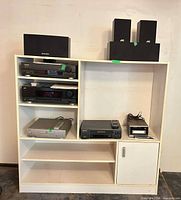 Entire lot on cabinet showing all components and speakers