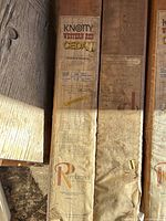 Close-up of factory label showing Knotty Western Red Cedar Tongue & Groove, Rembrandt branding, thickness details