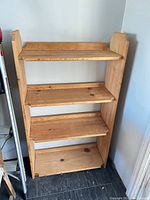 Front view showing full height and four shelves