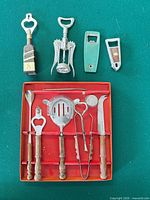 Entire boxed barware set with additional openers laid out