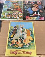 Three Walt Disney posters laid out: Bambi, Pinocchio, Lady and the Tramp showing overall condition and size relative to box