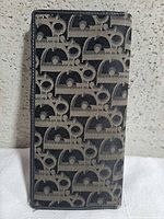 Front view showing grey/black Trotter canvas pattern and overall shape