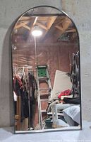 Front view showing arched glass and metal frame