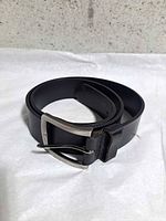 Rolled belt showing leather and buckle