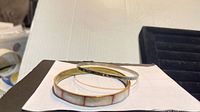 Both bangles stacked, showing materials and widths