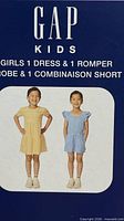 Gap Kids packaging showing images of dress and romper