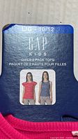 Packaging card showing Gap Kids 2-pack tops size L/G 10/12