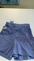 Front view of slate-blue linen shorts