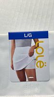 Front of Lole skort with hang tag showing size L/G and brand