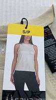 Front view of Spyder tank top with hang tag showing model image and size S/P