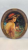 Front view of oval Coca-Cola tray with lady illustration