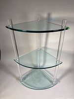 Full view of the three-tier glass and lucite corner table