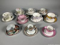 group shot of ten teacup and saucer sets