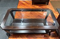 Top view showing rectangular beveled glass insert within dark wood frame