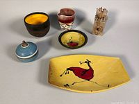 Group shot of all six signed pottery pieces