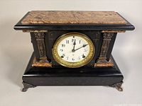 Front view of Seth Thomas Adamantine mantle clock showing case, dial and bezel