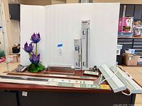 Group view of Kohler grab bar box, two strip lights, door sweep package and miscellaneous hardware