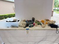 Overview of all rope, cord bundles, pulley blocks and hardware on table