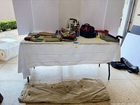 Wide view table with tools and drop cloth