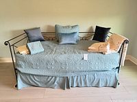 Full view of daybed with bedding and pillows