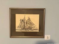Front view of framed ship print showing artwork, mat, and frame