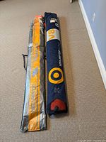 Both sail sleeves side by side on floor