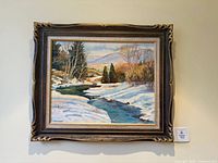 Framed oil painting showing entire artwork and signature area