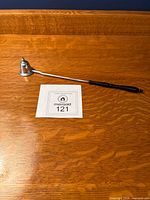 Full view of Gorham sterling silver candle snuffer showing overall length and handle