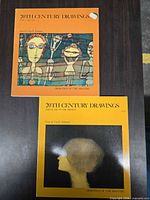 Front covers of both volumes showing titles and series