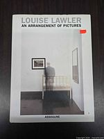 Front cover showing title, author, photo image, sticker