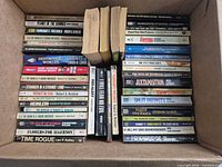 Top view of open box showing two stacks of vintage sci-fi paperbacks