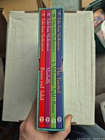 Spines of all four volumes in slipcase