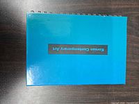 Front cover showing teal color and title text