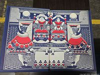 Two-color illustrated spread of playing-card court scene