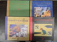 Front covers of all four Nick Bantock hardcover books