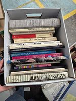 Top-down view of full box showing entire assortment of books