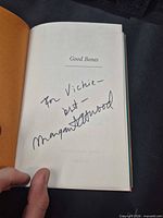 Title page showing author’s handwritten inscription and signature