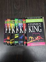 Front view showing all six volumes partially inside slipcase