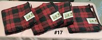 Four red & black plaid bath towels with tags displayed