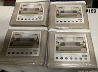 Four packaged Chiara Rose sofa covers