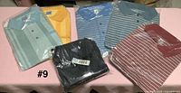 All six packaged polo shirts laid out