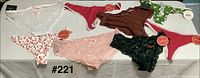 All eight pairs of new women’s underwear laid out showing colors, styles and attached tags