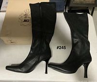 Side view of both boots with original box