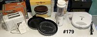 Group shot showing toaster, cake pan box, tart pans, personal blender, sandwich maker