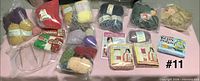 Overview of all bagged yarns and knit kits on table
