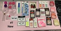 Overall view showing masks pack, Kiss nail sets, eyelash case, polish, storage jars, tools
